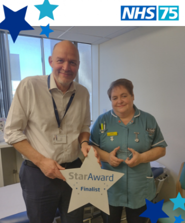 Star Award winner Kate Kennedy receiving her award from Simon Morritt, the Trust's Chief Executive.