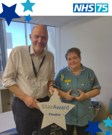 Star Award winner Kate Kennedy receiving her award from Simon Morritt, the Trust's Chief Executive