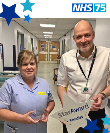 Star Award winner Tracey Robinson receiving her award from Simon Morritt, the Trust's Chief Executive