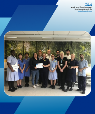 Star Award winners Ward 39 receiving their award from Simon Morritt, Chief Executive of the Trust