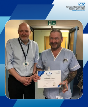 Richard Dixon receiving his Star Award and certificate from Simon Morritt, Chief Executive