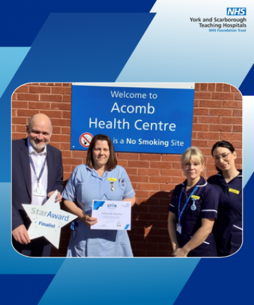 Deborah Martin receiving her Star Award and certificate from Simon Morritt, Chief Executive