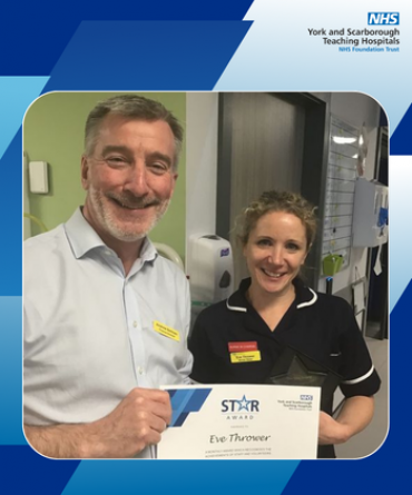 Eve Thrower receiving her Star Award and certificate from Andrew Bertram, Finance Director