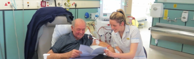 Patient Mr Gilpin with member of staff Faye Hornton talking to him