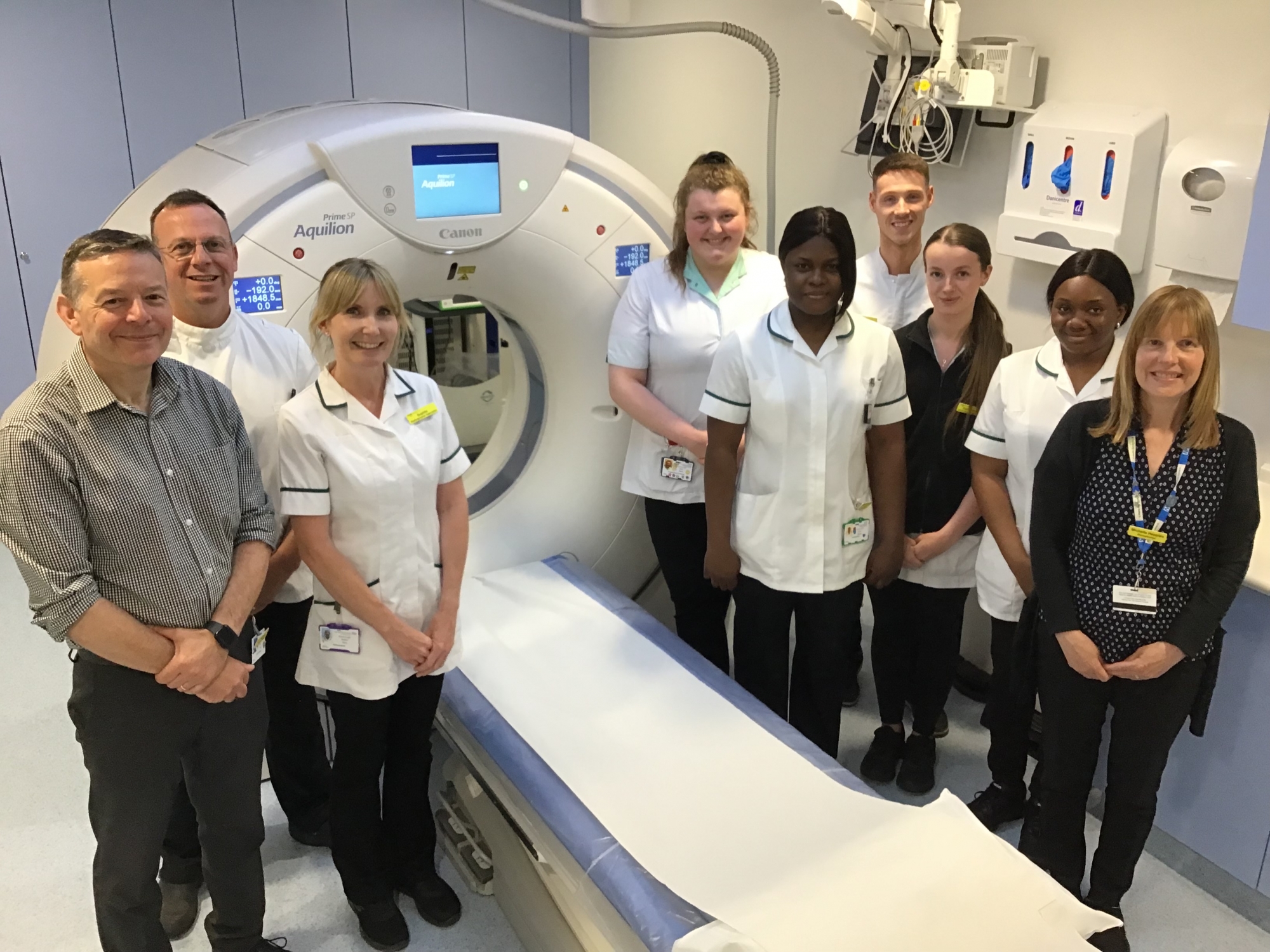 Scarborough Hospital Radiography team standing by the new CT scanner.