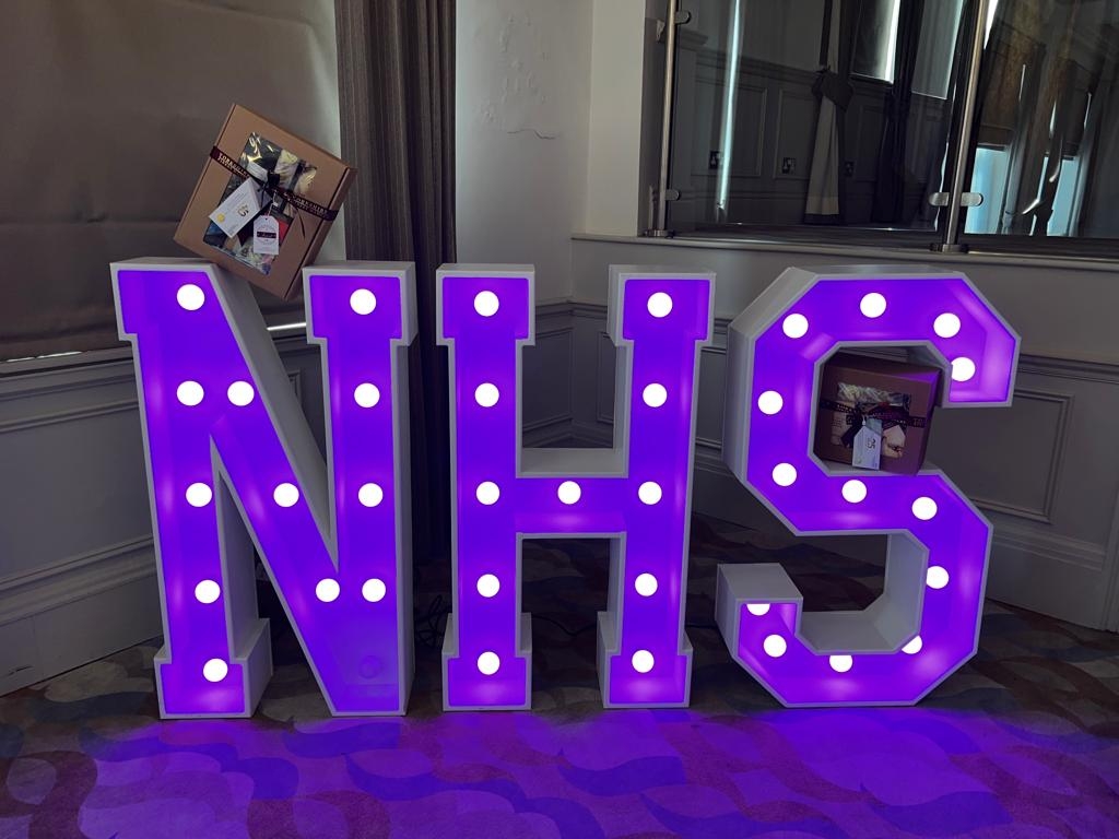 Light up giant letters spelling 'NHS'