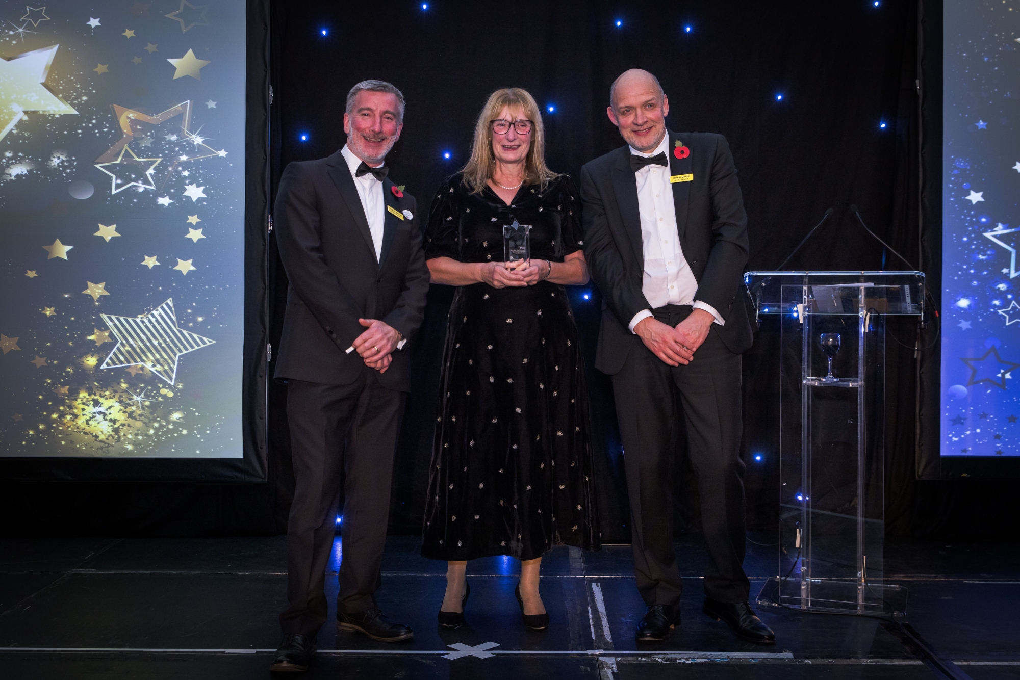 Philippa onstage at the awards ceremony with Simon Morritt and Andrew Bertram.